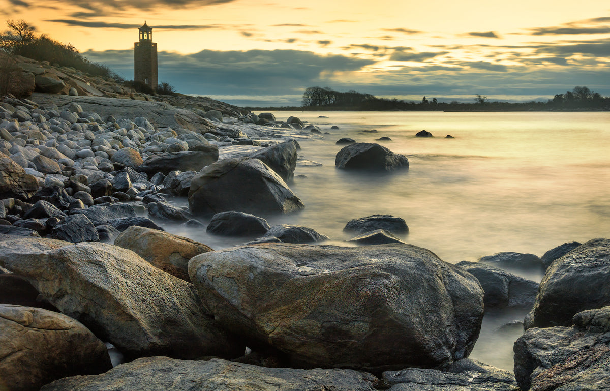 Mist rolls over the water at Avery Point in Groton as the sun rises over Pine Island. Owen Ehrlich