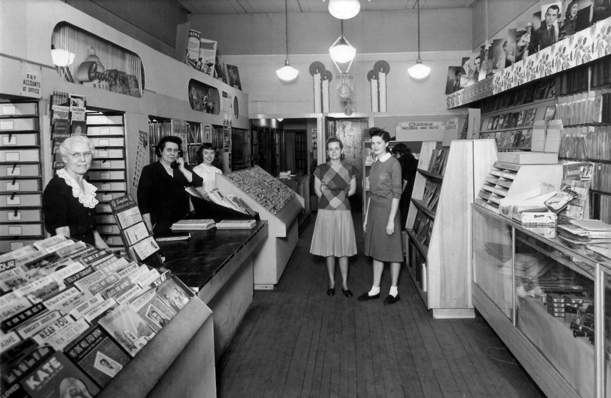 Workers and patrons at Miller Music, 419 North Main Street, 1946. From left: Ethell Phillips, Marguerite Burwitz, June Koerner, Lorene Miller and Mary Metzler. Courtesy Frank R Miller