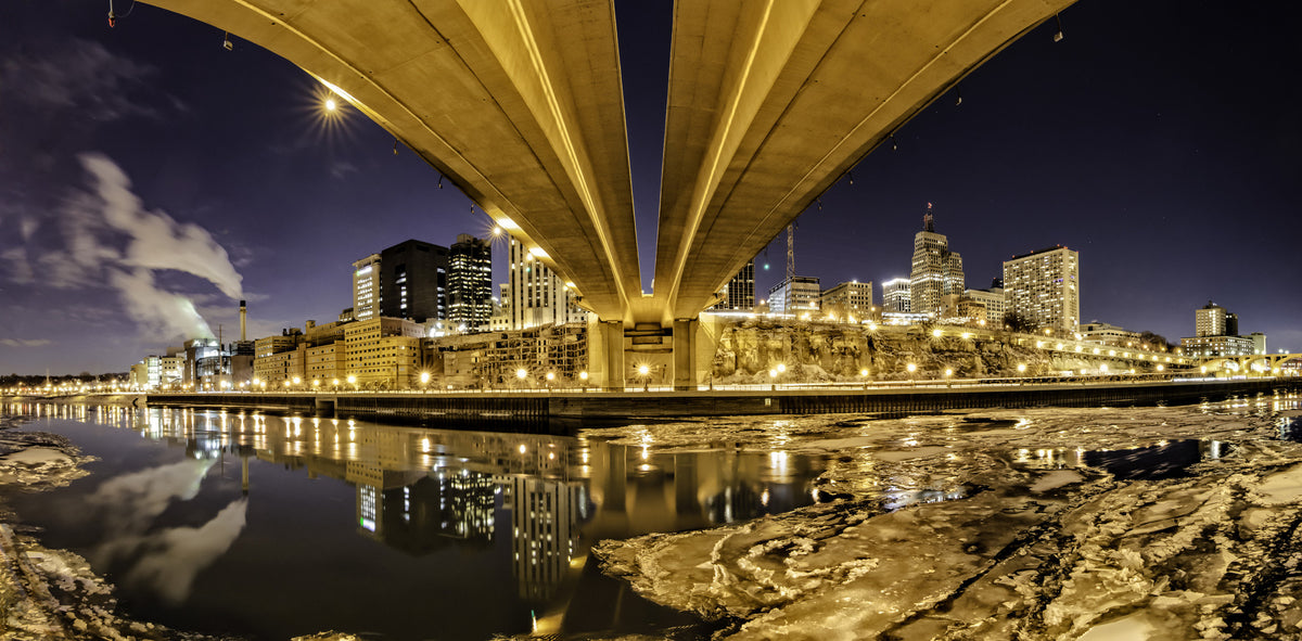 The ice was already breaking up in February the night I took this shot of St. Paul from under the Wabasha Street Bridge. Photograph by Sue Vruno
