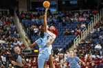 South Carolina’s Victaria Saxton (5) reaches for the point over North Carolina’s Anya Poole (31) during the Sweet 16 game at the Greensboro Coliseum, March 25, 2022. Tracy Glantz / The State