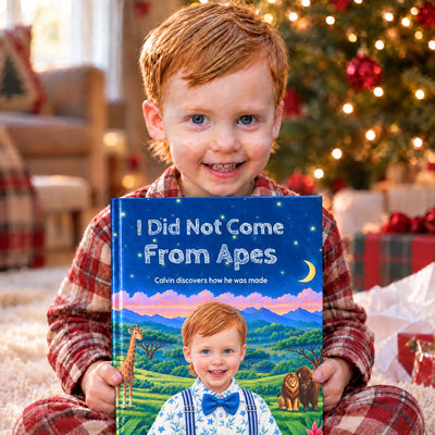 Calvin holding his personalized book on Christmas morning
